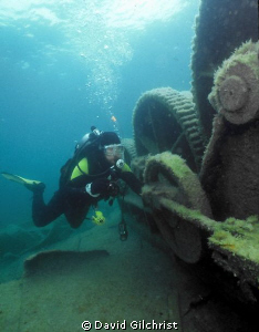 Diver examines equipment on the vessel Michigan, in Georg... by David Gilchrist 